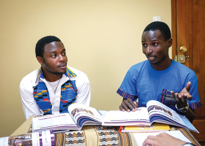 Maryknoll seminarians Joshua Mutende (white shirt) and Charles Ogony learn Spanish at the Maryknoll Mission Center in Cochabamba, Bolivia. (Nile Sprague/Bolivia)