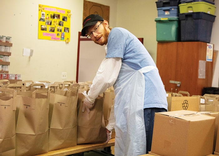 Before heading to his OTP in Bolivia, Maryknoll brother candidate Paul Shultz volunteered once a week at St. James Food Pantry in Chicago. (Octavio Duran/U.S.)