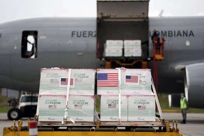 U.S. flags are taped on a shipment of Johnson & Johnson COVID-19 vaccines in Bogota, Colombia, July 1, 2021. (CNS photo/Nathalia Angarita, Reuters)