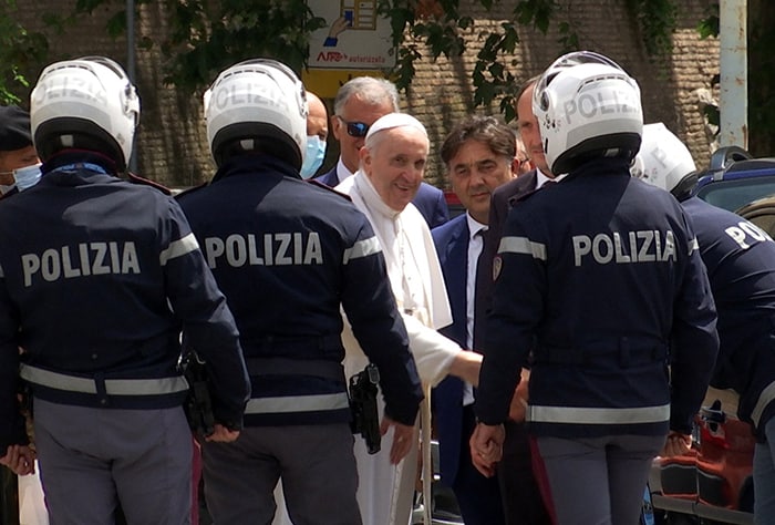 POPE RELEASE HOSPITAL Pope Francis greets police officers before entering the Vatican after being discharged from Rome's Gemelli hospital following his recovery from colon surgery in this screengrab taken from a video July 14, 2021. (CNS photo/Cristiano Corvino, Reuters TV screengrab)