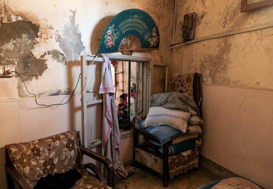 A young man sits in his home in a poor section of Tripoli, Lebanon, June 21, 2021. Lebanon's Christian advocates are urging that a special fund be established to address the continual flow of Christian emigration and to give them a solid reason to remain in their ancestral homeland. (CNS photo/Emilie Madi, Reuters)