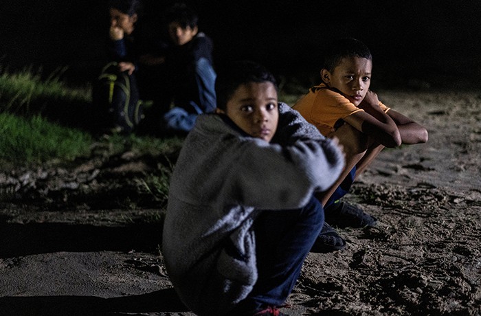 HONDURAN CHILDREN U.S. MIGRATION After World Mission Sunday Mass at St. Ferdinand Church, pastor Father Jason Torba and Cardinal Blase Cupich greet the congregation, including all those who do mission in Chicago. (Julie Jaidinger, Chicago Catholic/U.S.)