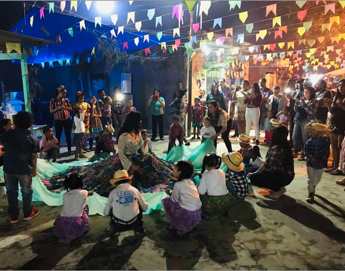 Margarita Durán leads the traditional skirt dance for children during Community Haiti’s “Festa Junina” celebration of the feast of St. John the Baptist. (Oscar Britez/Brazil)