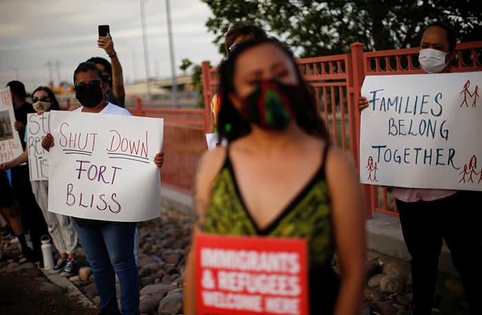FORT BLISS PROTEST After World Mission Sunday Mass at St. Ferdinand Church, pastor Father Jason Torba and Cardinal Blase Cupich greet the congregation, including all those who do mission in Chicago. (Julie Jaidinger, Chicago Catholic/U.S.)