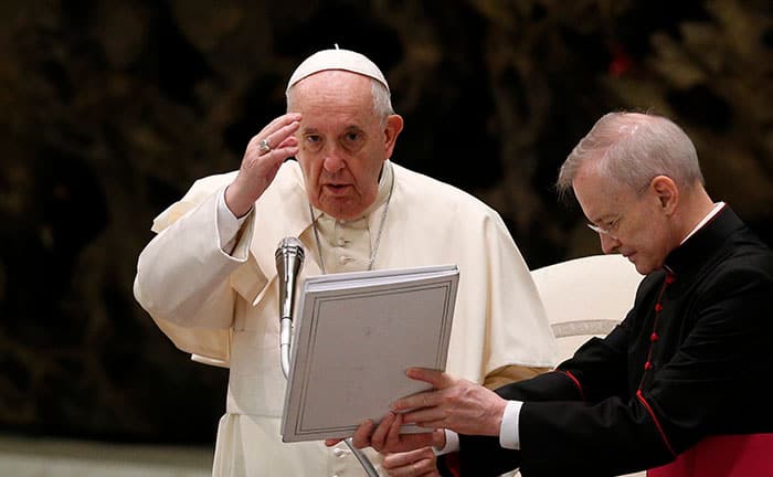 Before the quarantine and trauma of COVID-19, Father Dennis Moorman distributed Holy Communion at Mass at St. Joseph Church in Peruas, Sao Paulo, Brazil. (Nile Sprague/Brazil)