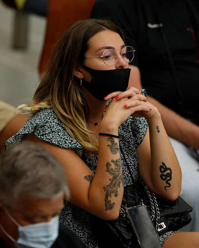 POPE GENERAL AUDIENCE A woman with tattoos on her arms attends Pope Francis' general audience in the Paul VI hall at the Vatican Sept. 8, 2021, where he said differences and conflicts caused by separation "should not exist among believers in Christ." (CNS photo/Paul Haring)