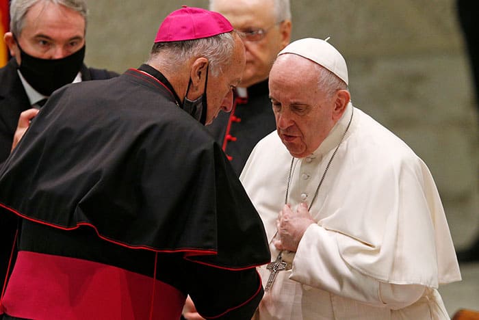 After World Mission Sunday Mass at St. Ferdinand Church, pastor Father Jason Torba and Cardinal Blase Cupich greet the congregation, including all those who do mission in Chicago. (Julie Jaidinger, Chicago Catholic/U.S.)