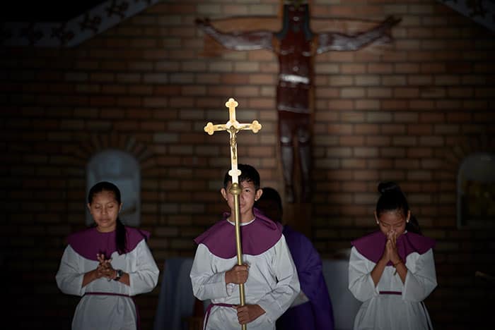 After World Mission Sunday Mass at St. Ferdinand Church, pastor Father Jason Torba and Cardinal Blase Cupich greet the congregation, including all those who do mission in Chicago. (Julie Jaidinger, Chicago Catholic/U.S.)