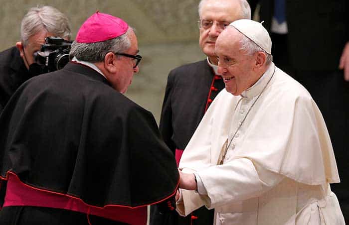 After World Mission Sunday Mass at St. Ferdinand Church, pastor Father Jason Torba and Cardinal Blase Cupich greet the congregation, including all those who do mission in Chicago. (Julie Jaidinger, Chicago Catholic/U.S.)