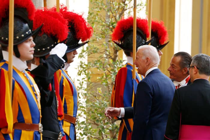 U.S. President Joe Biden turns toward Swiss Guards in the San Damaso Courtyard of the Apostolic Palace as he leaves after a meeting with Pope Francis at the Vatican Oct. 29, 2021. (CNS photo/Paul Haring)