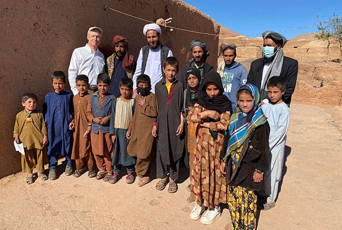 afghans need help- Kevin Hartigan, regional director for Catholic Relief Services, poses with farmers and their families in the drought-affected farming community in Adraskan, Afghanistan, Nov. 2, 2021. (CNS photo/Kevin Hartigan, CRS)