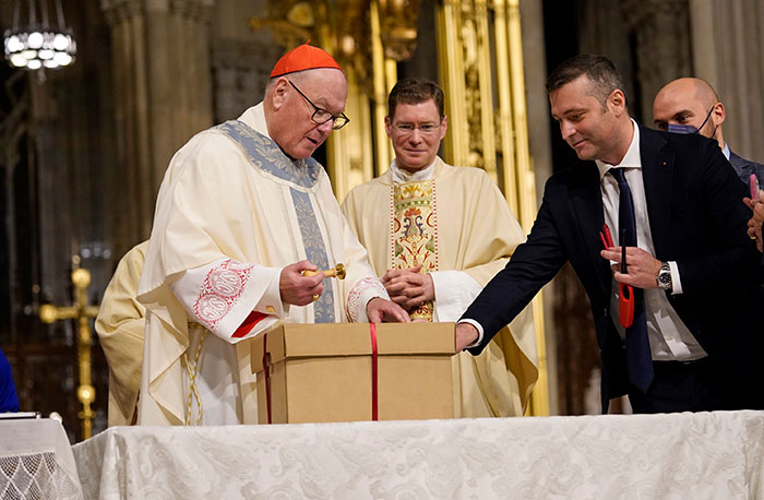 After World Mission Sunday Mass at St. Ferdinand Church, pastor Father Jason Torba and Cardinal Blase Cupich greet the congregation, including all those who do mission in Chicago. (Julie Jaidinger, Chicago Catholic/U.S.)