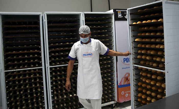 20211214T1030-UN-HUNGER-REPORT-1514210-RESIZED A baker works at a bakery at the Sanctuary of Our Lady of Fatima, where bread is produced to be distributed to vulnerable people due to food insecurity, during the COVID-19 outbreak, in Rio de Janeiro June 2, 2021. A report released in late November by several United Nations’ agencies warned that the number of those suffering from hunger in Latin America and the Caribbean is at its highest point in 15 years. (CNS photo/Ricardo Moraes, Reuters)
