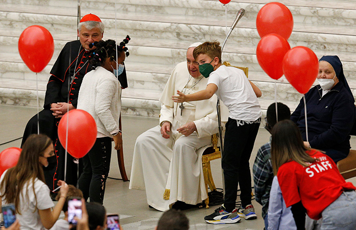 After World Mission Sunday Mass at St. Ferdinand Church, pastor Father Jason Torba and Cardinal Blase Cupich greet the congregation, including all those who do mission in Chicago. (Julie Jaidinger, Chicago Catholic/U.S.)