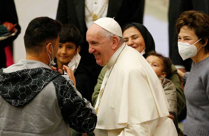 Pope Francis greets people during his general audience in the Paul VI hall at the Vatican Dec. 22, 2021. (CNS photo/Paul Haring)