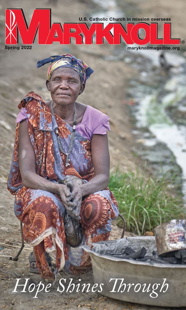 A woman sells charcoal by a drainage ditch inside a U.N. camp for displaced people near Malakal, South Sudan. (Paul Jeffrey/South Sudan)