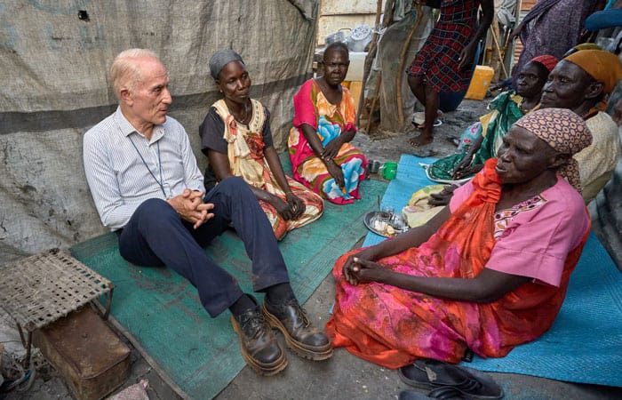 Father Bassano talks with women inside the Protection of Civilians area inside the U.N. base in Malakal, South Sudan, which shelters approximately 35,000 displaced people. (Paul Jeffrey/South Sudan)