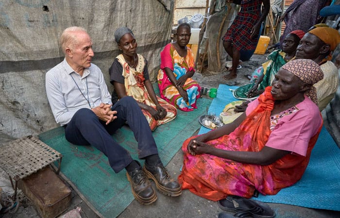 24-29-Bassano-01 Father Bassano talks with women inside the Protection of Civilians area inside the U.N. base in Malakal, South Sudan, which shelters approximately 35,000 displaced people. (Paul Jeffrey/South Sudan)