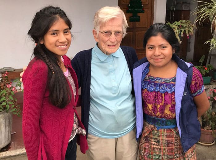 Sister Helen Werner poses with young friends in Lemoa. Over the years, she assisted many Guatemalan students with scholarships to further their studies. (Charlotte Tomaino/Guatemala)