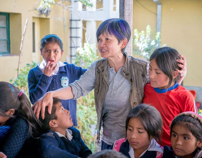 Nguyen is pictured surrounded by children who attend the after-school program at the parish house in Tacopaya, Bolivia. (Nile Sprague/Bolivia)