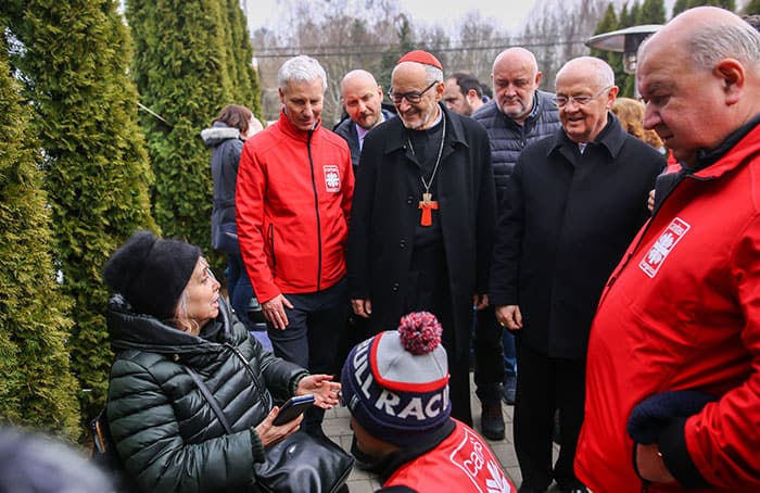 After World Mission Sunday Mass at St. Ferdinand Church, pastor Father Jason Torba and Cardinal Blase Cupich greet the congregation, including all those who do mission in Chicago. (Julie Jaidinger, Chicago Catholic/U.S.)