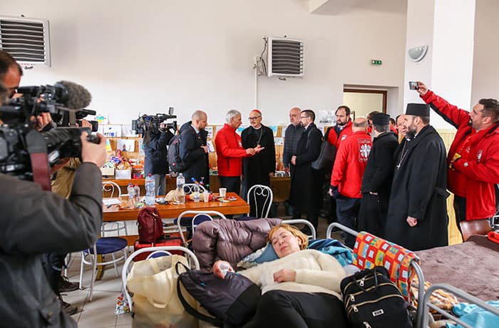 After World Mission Sunday Mass at St. Ferdinand Church, pastor Father Jason Torba and Cardinal Blase Cupich greet the congregation, including all those who do mission in Chicago. (Julie Jaidinger, Chicago Catholic/U.S.)