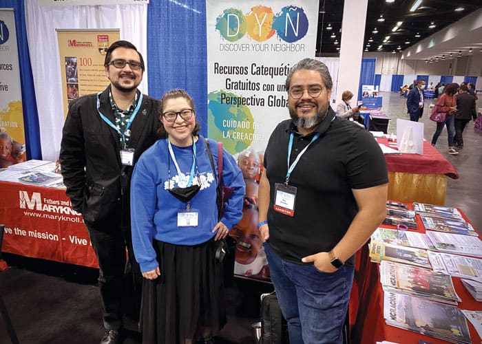 Los Angeles community members John-Michael Rogers (left) and Alexis Salazar greet mission promoter Ray Almanza at the 2022 Religious Education Congress in Anaheim, California. (Courtesy Ray Almanza/U.S.)
