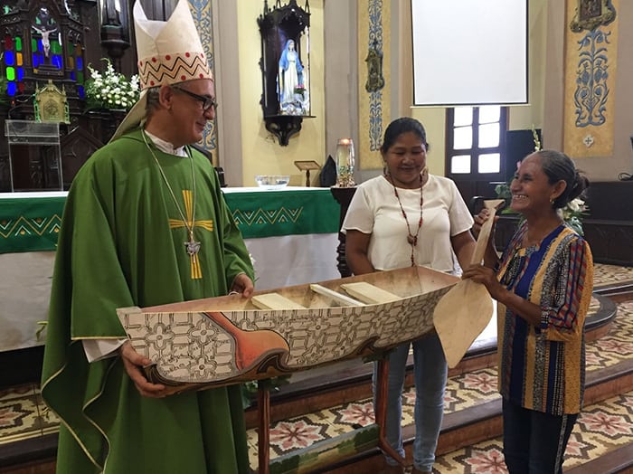 After World Mission Sunday Mass at St. Ferdinand Church, pastor Father Jason Torba and Cardinal Blase Cupich greet the congregation, including all those who do mission in Chicago. (Julie Jaidinger, Chicago Catholic/U.S.)