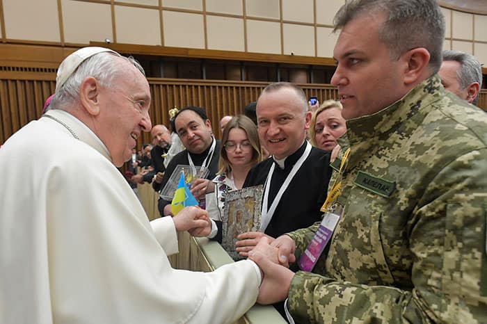 After World Mission Sunday Mass at St. Ferdinand Church, pastor Father Jason Torba and Cardinal Blase Cupich greet the congregation, including all those who do mission in Chicago. (Julie Jaidinger, Chicago Catholic/U.S.)