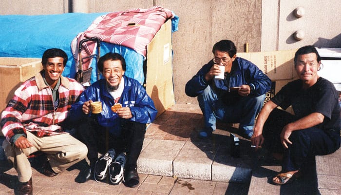 24-28-DeMello-02 De Mello visits homeless friends living in cardboard boxes along Tokyo’s Sumida River. (Courtesy Merwyn De Mello/Japan)
