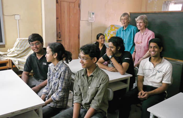 44-48-Sr.-Miriam-02. Cofounders of BACHA Sisters Miriam Francis Perlewitz and Joan Cordis Westhues (blue blouse) are shown with adolescent students in 2009. (Sean Sprague/Bangladesh)