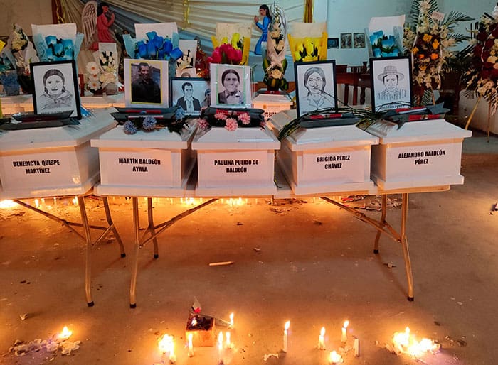 The remains of victims of a 1985 massacre in Accomarca, Peru, are seen during a vigil with their relatives in the village church May 18, 2022. Hundreds of people gathered in the tiny Andean village for the burial of the remains of 50 victims of a brutal massacre committed by Peruvian soldiers in 1985. (CNS photo/Jacqueline Fowks)