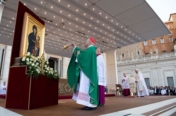 After World Mission Sunday Mass at St. Ferdinand Church, pastor Father Jason Torba and Cardinal Blase Cupich greet the congregation, including all those who do mission in Chicago. (Julie Jaidinger, Chicago Catholic/U.S.)