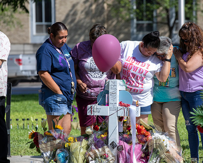 Grieving families and community members gather at the memorial site in downtown Uvalde, Texas, where crosses and gifts offer tribute to the 19 students and two teachers killed in a mass shooting at Robb Elementary School. (Octavio Duran/U.S.)
