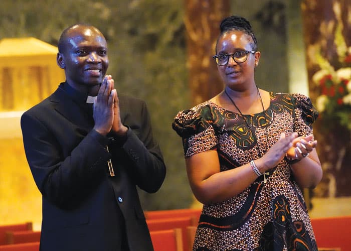 During their sending ceremony, Maryknoll Father John Siyumbu was called to mission in Latin America and Maryknoll Sister Faithmary Munyeki to Brazil. Following custom, the missioners each received a missionary cross. (Gregory A. Shemitz/U.S.)