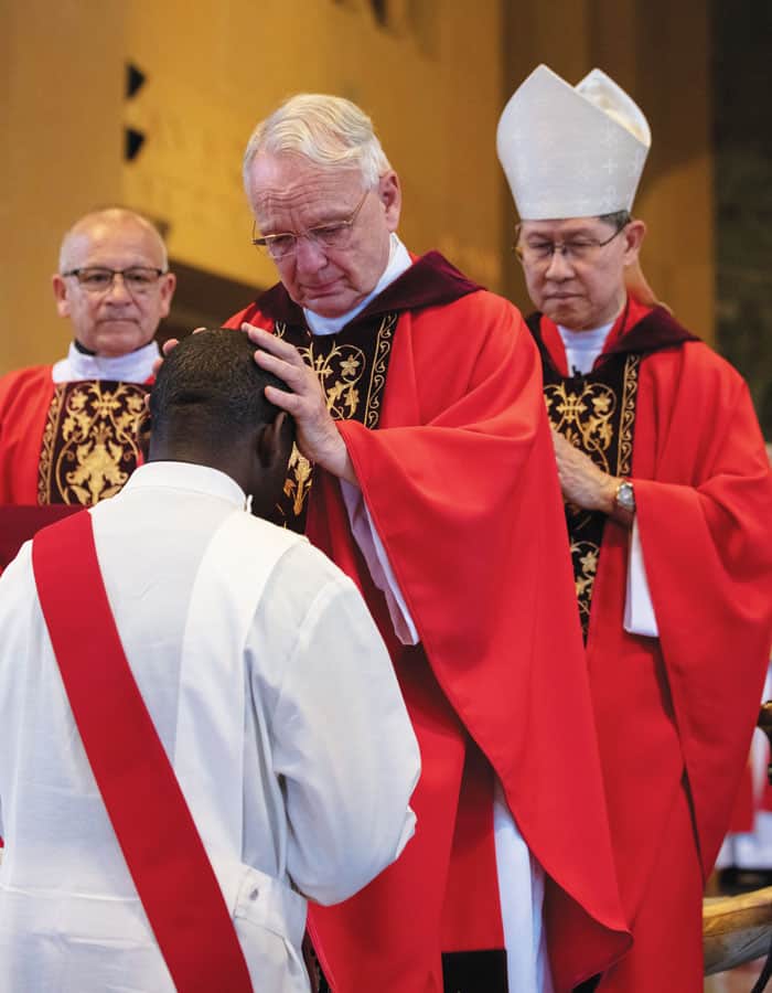 Maryknoll Superior General Father Lance Nadeau blesses the candidate. (Octavio Durán/U.S.)