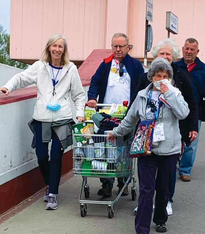 In Warsaw, Maryknoll Affiliates (clockwise) Pam Cibik, Ken Palisin, Janet Alberti and Lita Sharone shop for supplies. Not pictured: Curtis Alberti (Courtesy Janet Alberti/Poland)