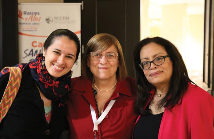 Elisabeth Román, National Catholic Council for Hispanic Ministry president (right), smiles with speakers Susana Nuin (center) and María José Centurión. (Jesús Picón/U.S.)