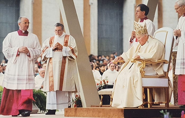 After World Mission Sunday Mass at St. Ferdinand Church, pastor Father Jason Torba and Cardinal Blase Cupich greet the congregation, including all those who do mission in Chicago. (Julie Jaidinger, Chicago Catholic/U.S.)