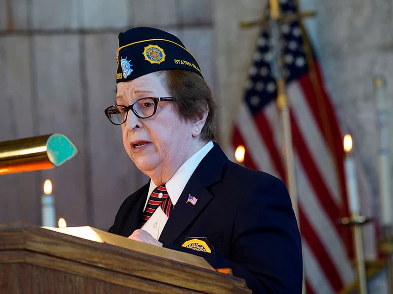 U.S. Army veteran Mary McLoone, who served as a nurse in Vietnam, is a lector during a Mass marking the 55th anniversary of the death of Maryknoll Father Vincent R. Capodanno at the Father Capodanno Memorial Chapel at Fort Wadsworth in Staten Island, N.Y., Sept. 4, 2022. Father Capodanno, a native of Staten Island, was killed while ministering as a U.S. Navy chaplain to wounded Marines on a battlefield in Vietnam. (CNS photo/Gregory A. Shemitz)
