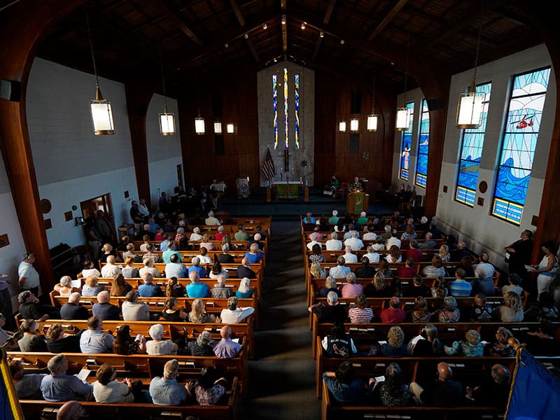 People attend a Mass marking the 55th anniversary of the death of Maryknoll Father Vincent R. Capodanno at the Father Capodanno Memorial Chapel at Fort Wadsworth in Staten Island, N.Y., Sept. 4, 2022. Father Capodanno, a native of Staten Island, was killed while ministering as a U.S. Navy chaplain to wounded Marines on a battlefield in Vietnam. (CNS photo/Gregory A. Shemitz)