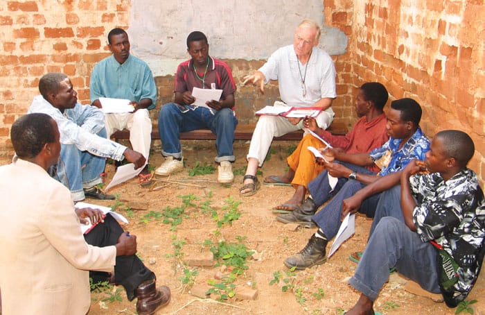 34-38-Synod-02 In Mozambique in 2004, Maryknoll Father Thesing converses with leaders of small worship communities. Missioners value listening and dialogue. (Mark Gruenke, Maryknoll Mission Archives)
