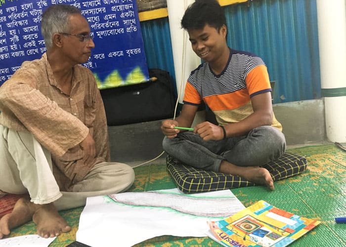 Merwyn listens as a L’Arche volunteer shares his river of life. Kirstin and Merwyn facilitated several sessions on trauma awareness for L’Arche volunteers in Mymensingh, Bangladesh in 2019.