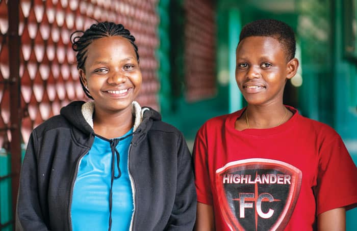 Emusoi graduates Dianes Saikong (left) and Flora Leiyo return to the center in Arusha to mentor younger girls during breaks from teachers’ college. (Gregg Brekke/Tanzania)
