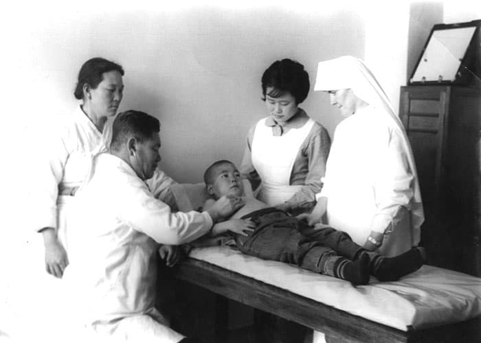 Maryknoll Sister Jean Maloney (in habit), a nurse, has lived for 70 years in Korea, where she has served in various ministries for the sick, workers and exploited women. (Maryknoll Mission Archives)