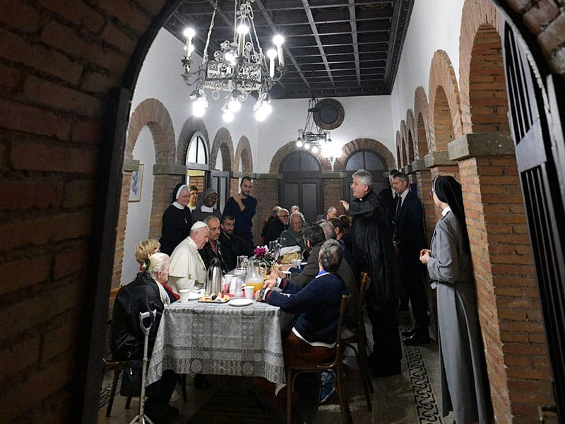 After World Mission Sunday Mass at St. Ferdinand Church, pastor Father Jason Torba and Cardinal Blase Cupich greet the congregation, including all those who do mission in Chicago. (Julie Jaidinger, Chicago Catholic/U.S.)