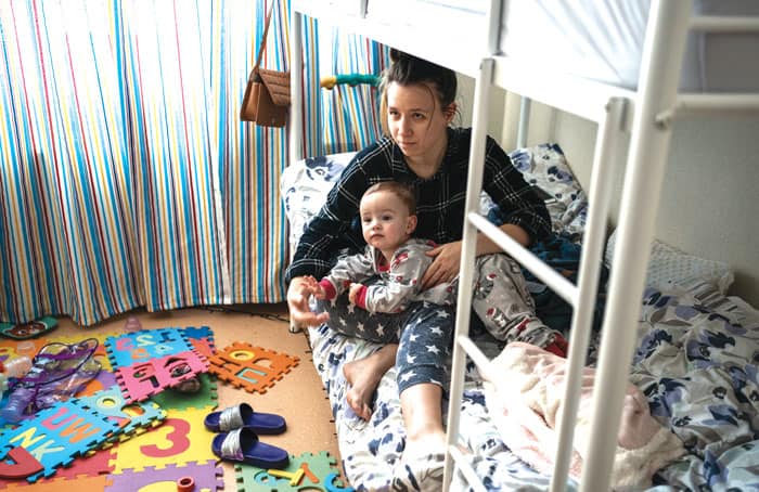 Dasha Habovska and her son, Christian, are internally displaced persons living in Fastiv, Ukraine, following the Russian invasion and bombardment of their home in Kherson. (Gregg Brekke/Ukraine)