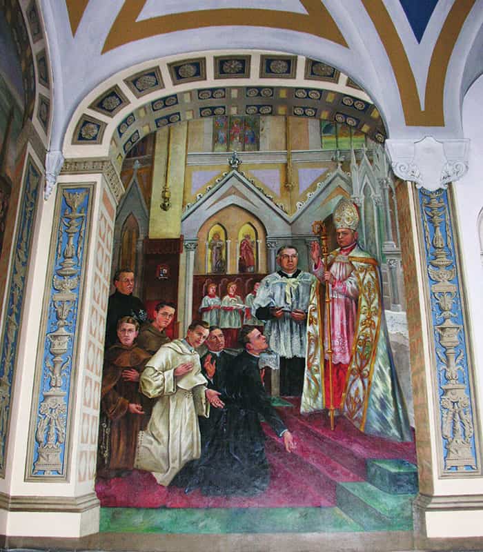 Walsh_mural After World Mission Sunday Mass at St. Ferdinand Church, pastor Father Jason Torba and Cardinal Blase Cupich greet the congregation, including all those who do mission in Chicago. (Julie Jaidinger, Chicago Catholic/U.S.)