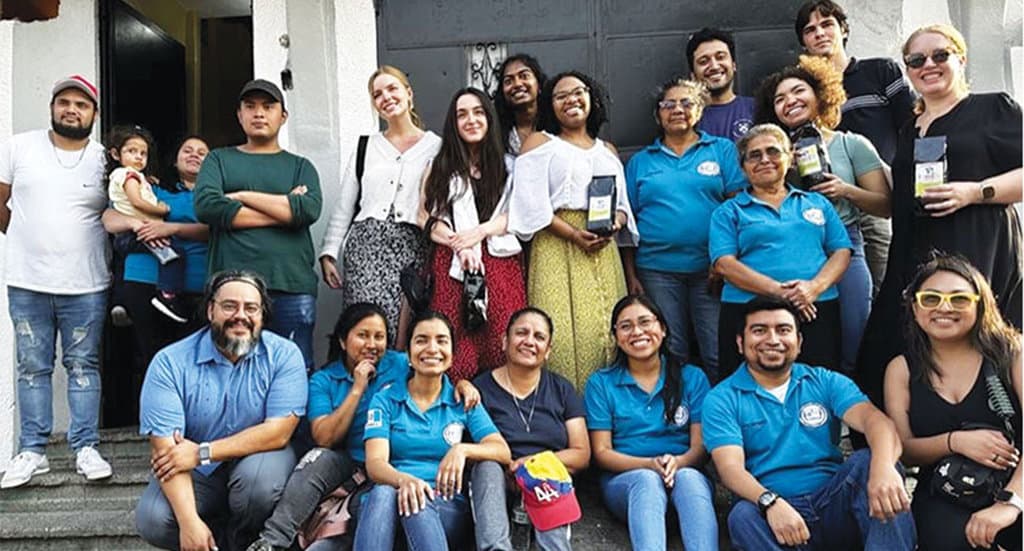 Maryknoll affiliates (blue polo shirts) host Yale University students and Maryknoll staff including Ray Almanza and Luna Stephanie (bottom row, far left and far right) at Caminando Por La Paz. (Courtesy of Luna Stephanie/Guatemala)