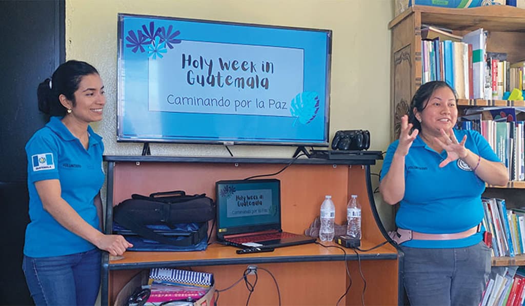 52-55-Mission-for-Peace-02 Maryknoll Affiliates (left to right) Isis Miranda and Karla Gonzalez give a presentation to immersion trip participants. (Courtesy of Jennifer Schaaf/Guatemala)